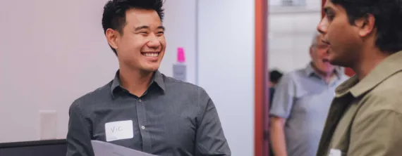man smiling while networking