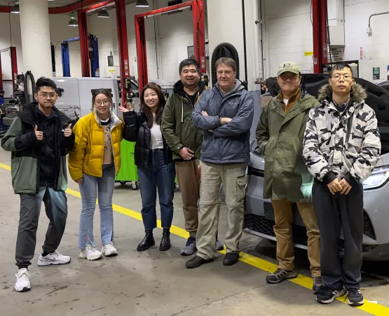 Volcrafter team standing in automotive shop