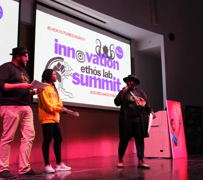 Three people on stage