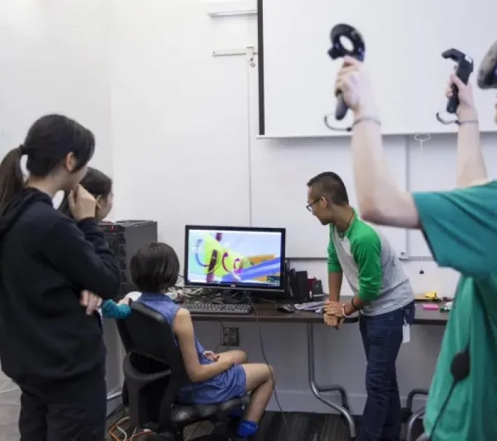 Students playing with a VR headset
