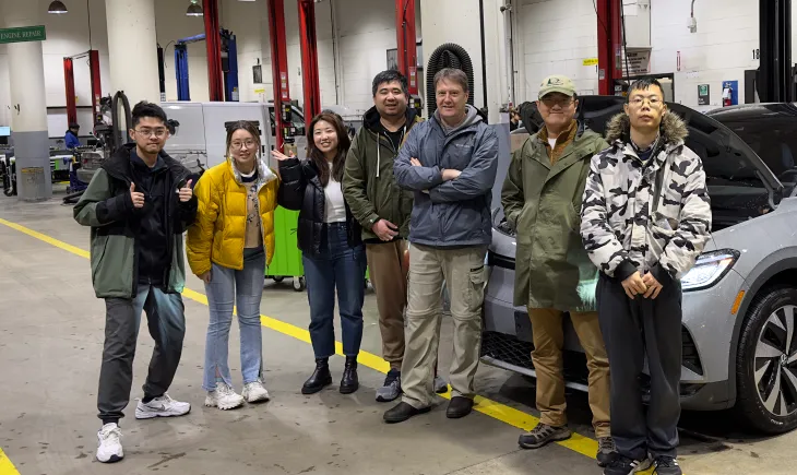 Volcrafter team standing in automotive shop